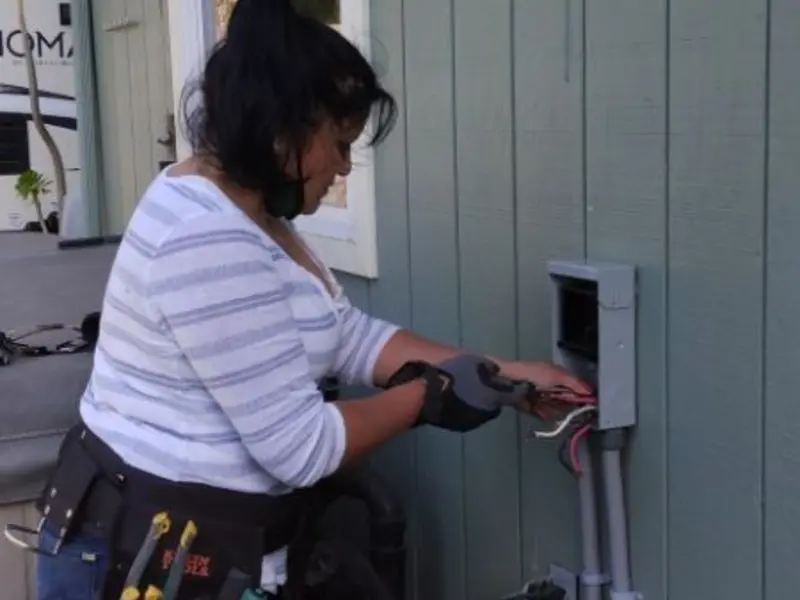 Licensed electrician wiring an exterior subpanel in Winchester