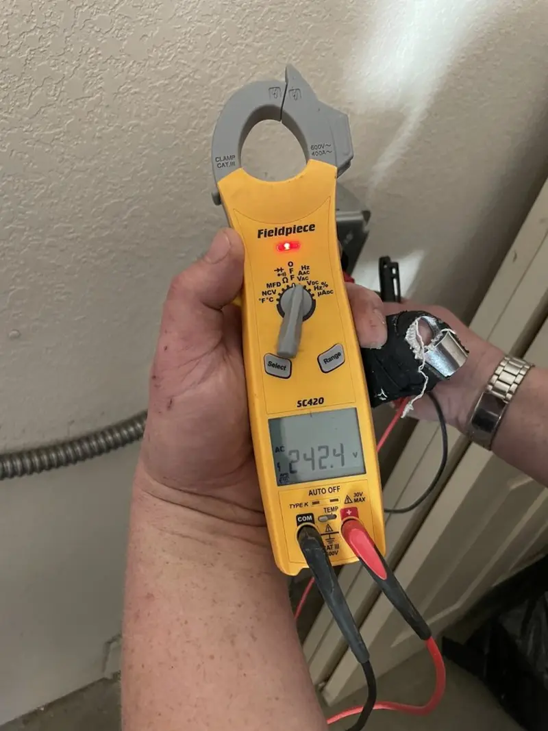 Voltage testing with clamp meter during Whole House Surge Protector in Winchester